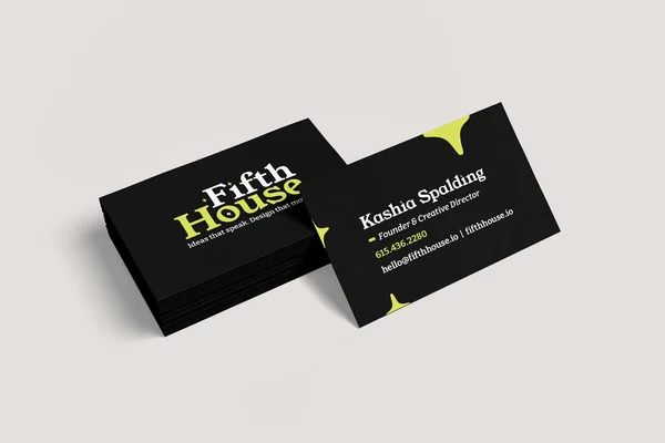Stack of black FifthHouse business cards with lime accents, the top card showing contact details for Kashia Spalding.