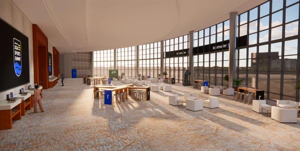 Long naturally lit room with lounge seating, game tables, and Ticketmaster signage along the far wall.